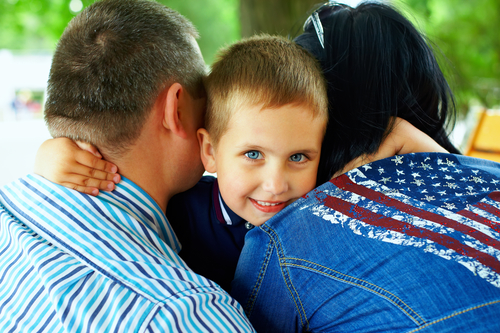 child hugging parents 